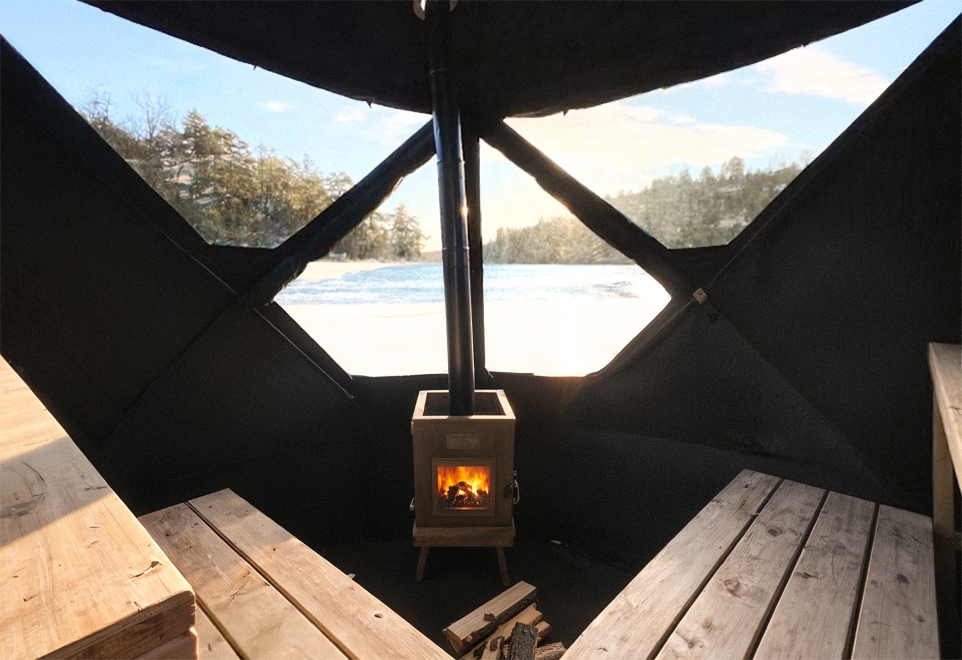 Wood-fired sauna tent on a snowy Arctic shoreline