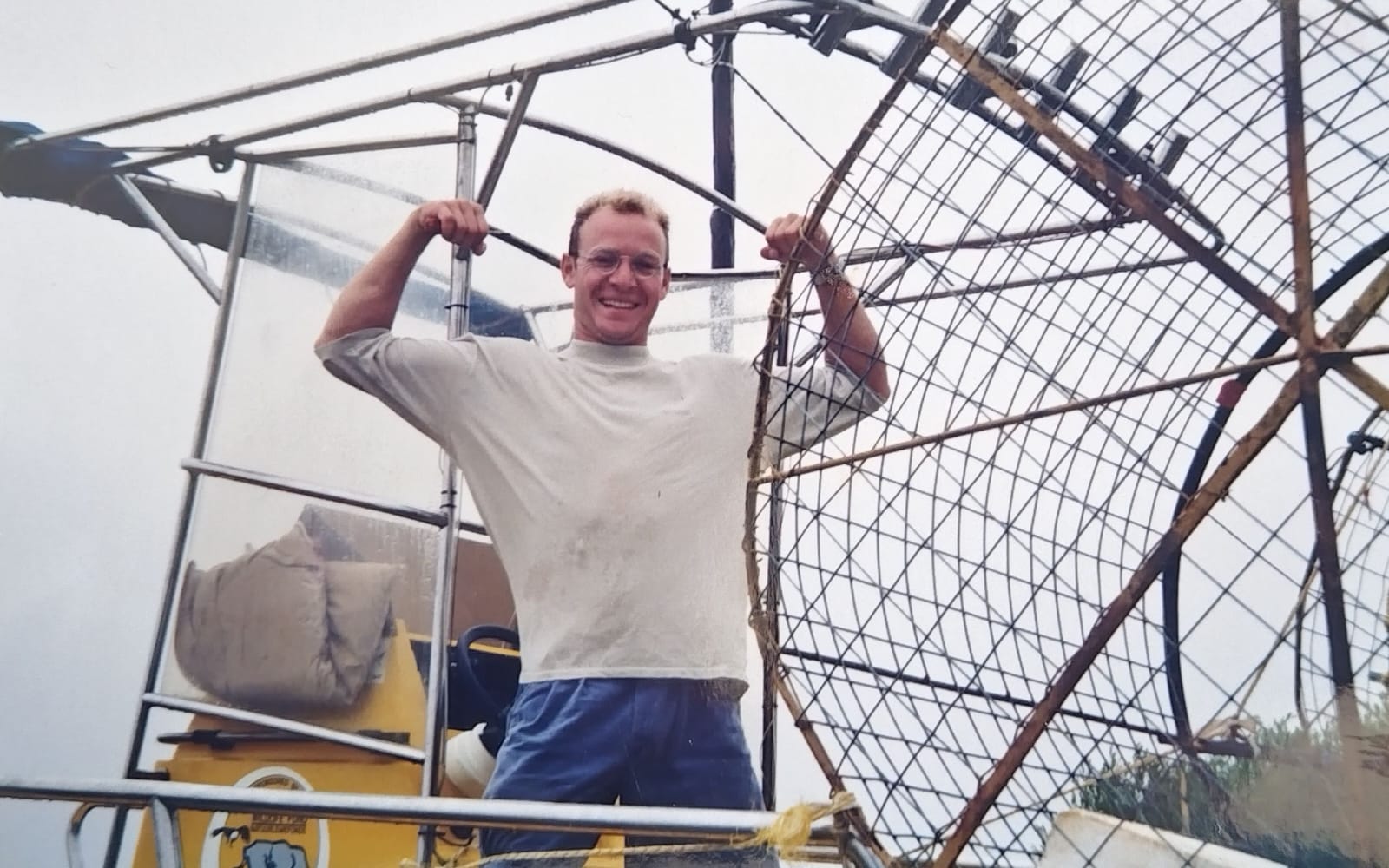 A young Craig Ferreira grinning on the deck of an airboat