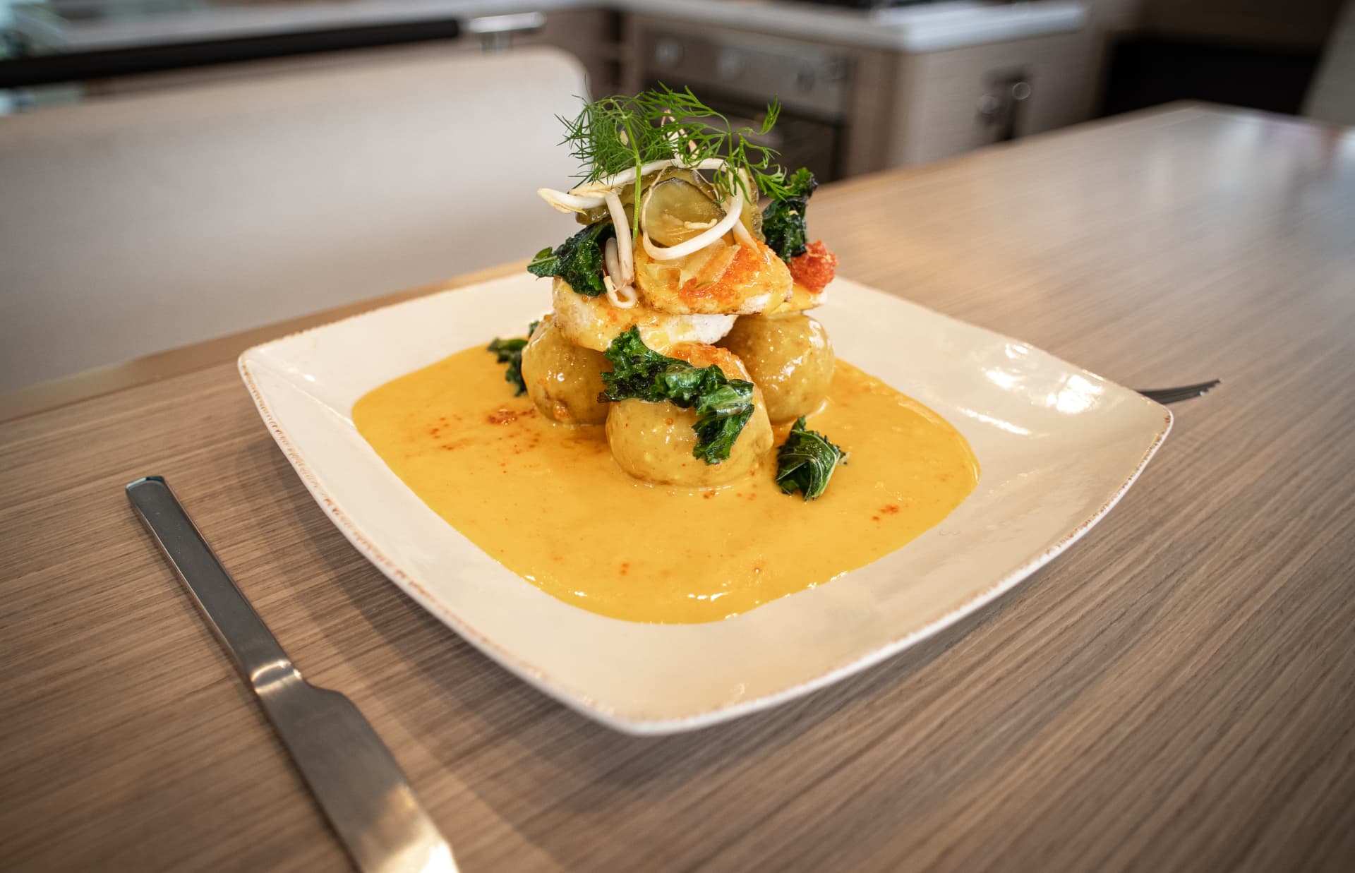 A freshly prepared fish dish served aboard the catamaran